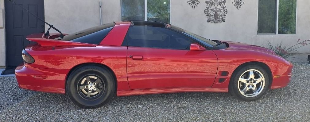 Red Trans Am, side view